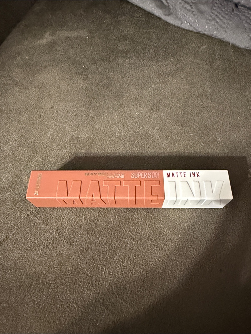 Maybelline SuperStay Matte Ink lip stain in a milk chocolate shade.